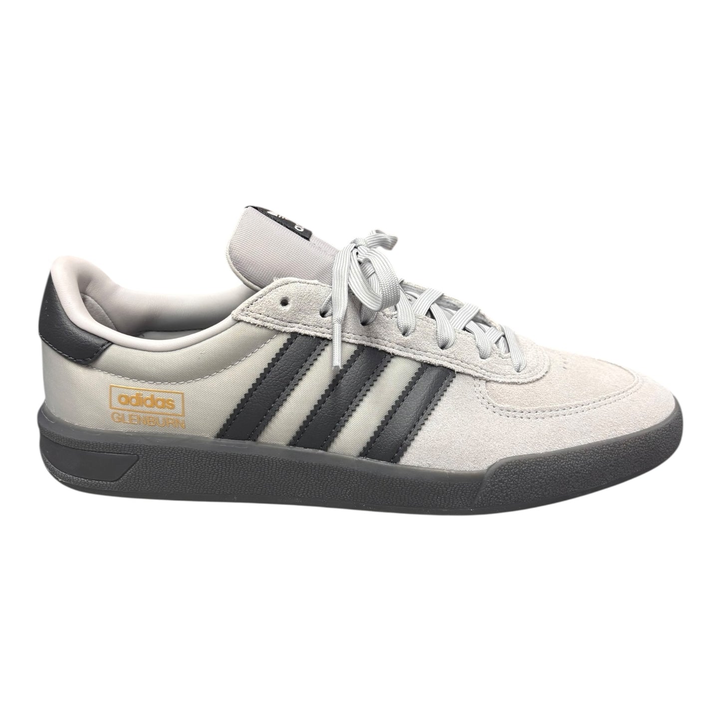 White Adidas sneaker with black stripes on a white background