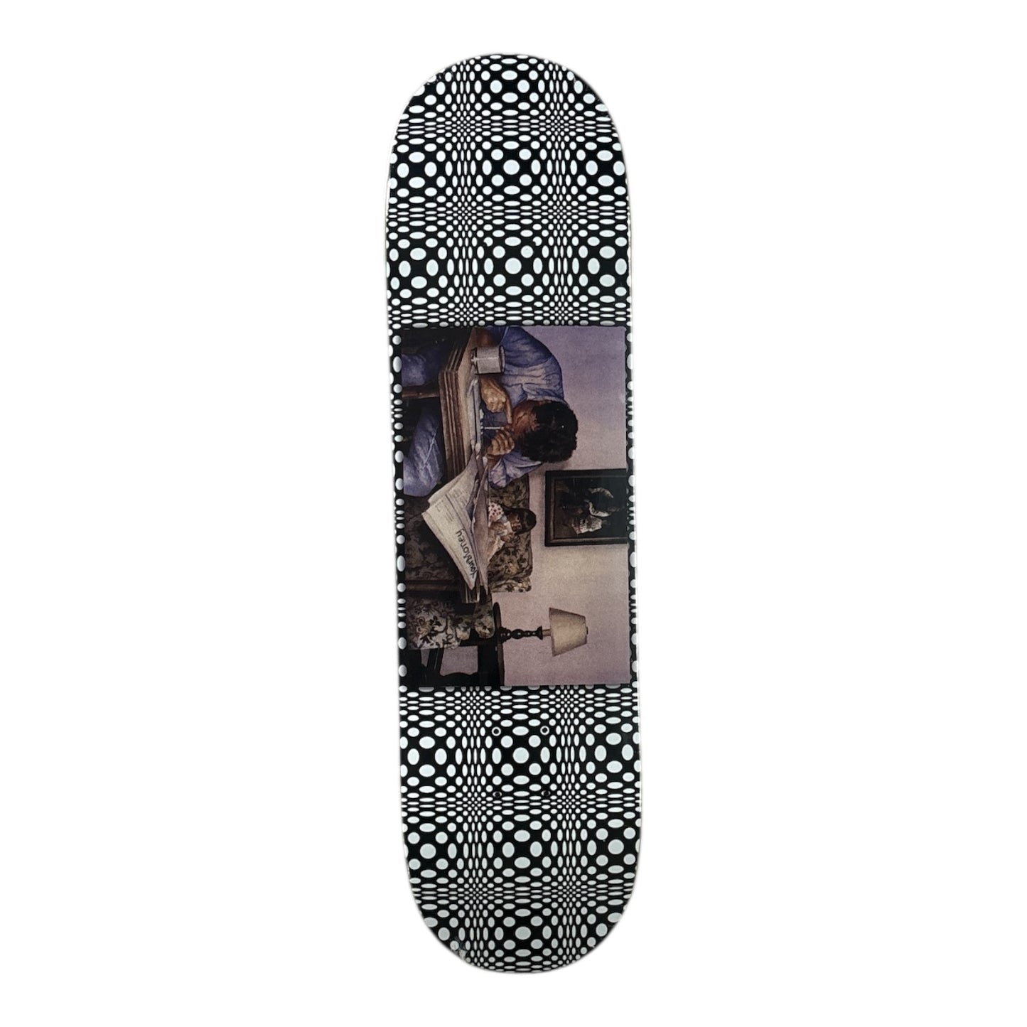 Skateboard deck with black and white pattern and a photo of a woman on a white background