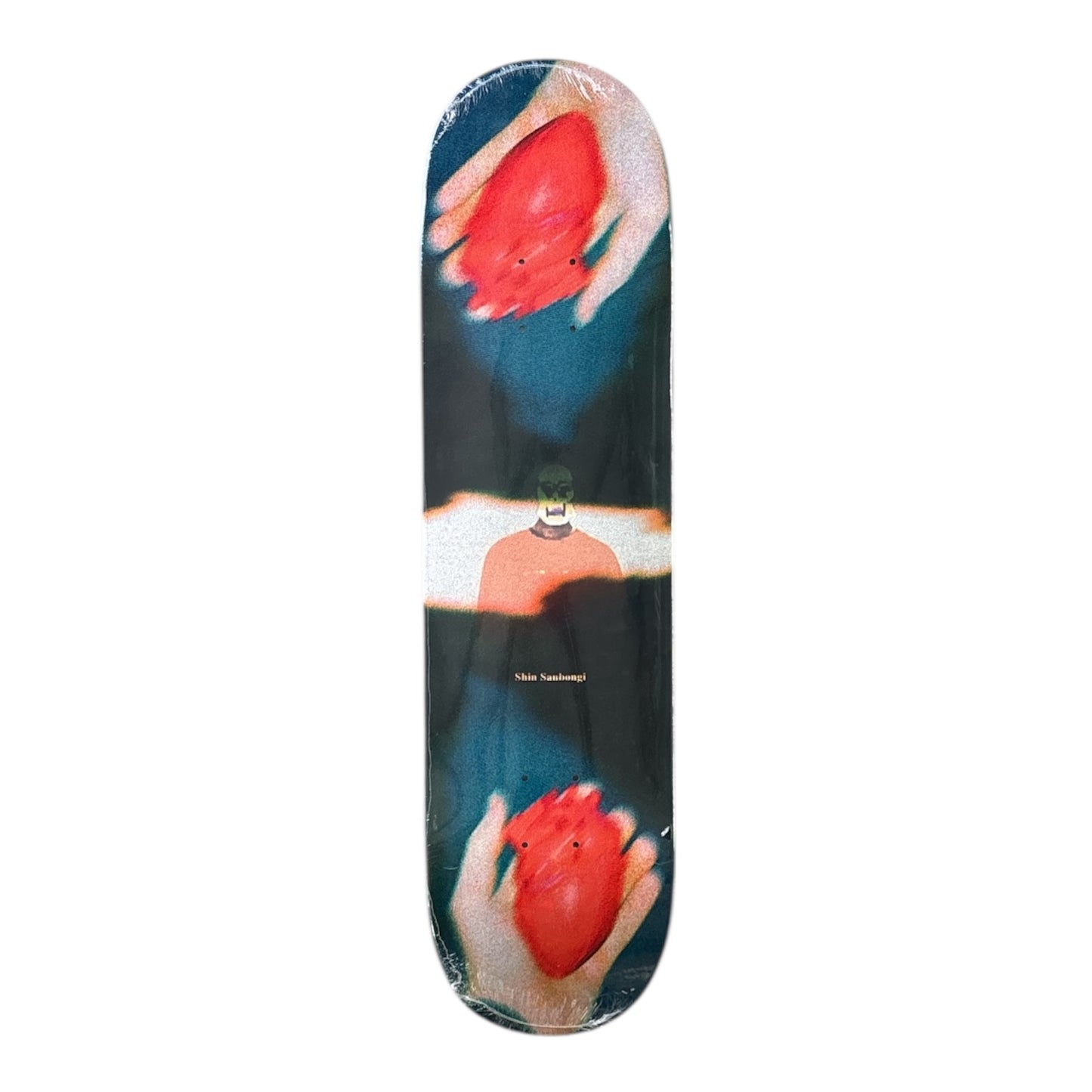 Skateboard deck with artistic design of hands holding a red heart.