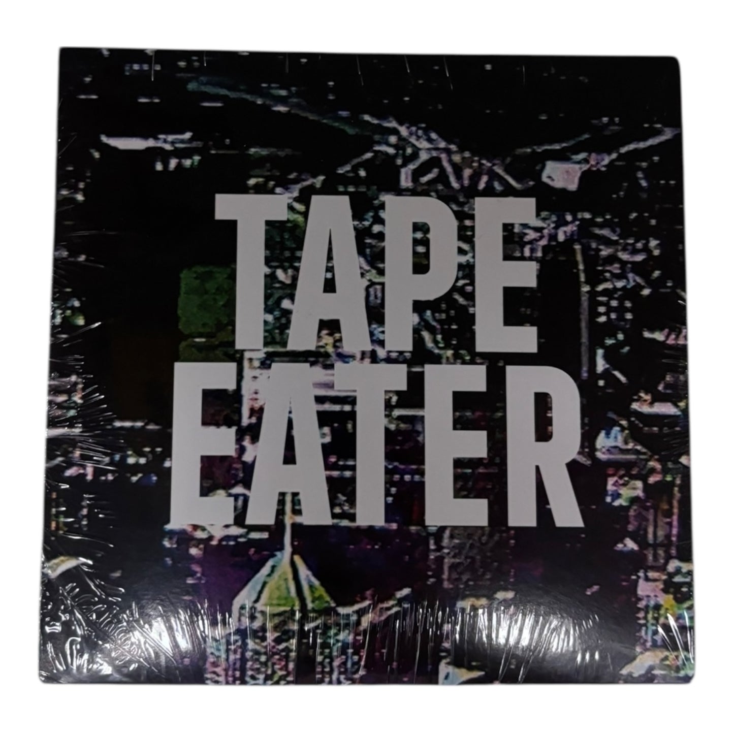 Vinyl record with 'Tape Eater' text on a colorful abstract background