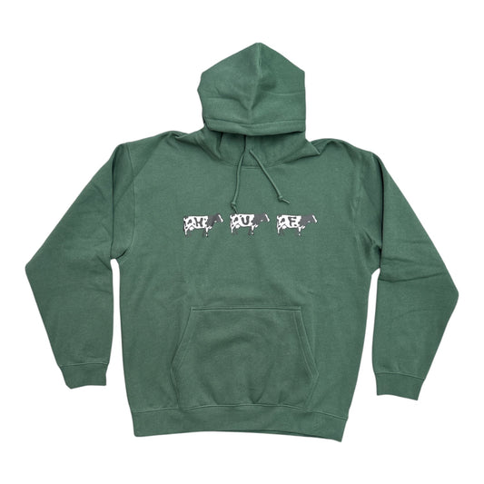 A green pullover hoodie with a drawstring hood and kangaroo pocket, featuring a graphic across the chest with three stylized cow silhouettes spelling out 'HUF'.