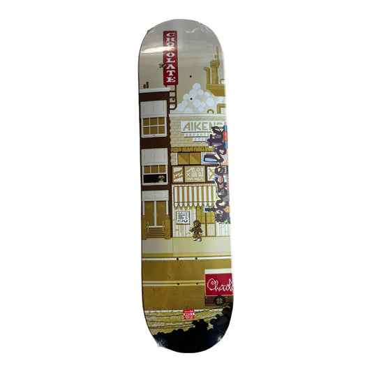 Chocolate Deck with picture of pixelated city in yellow tones.