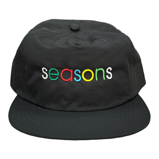 Black hat multi color letters saying seasons 
