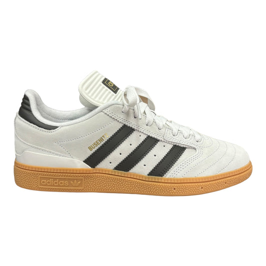 Adidas Busenitz, its in off-white with black stripes and gum, rubber out soul