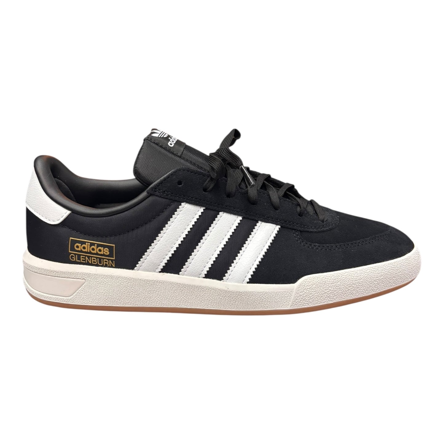 Black Adidas sneaker with white stripes on a white background