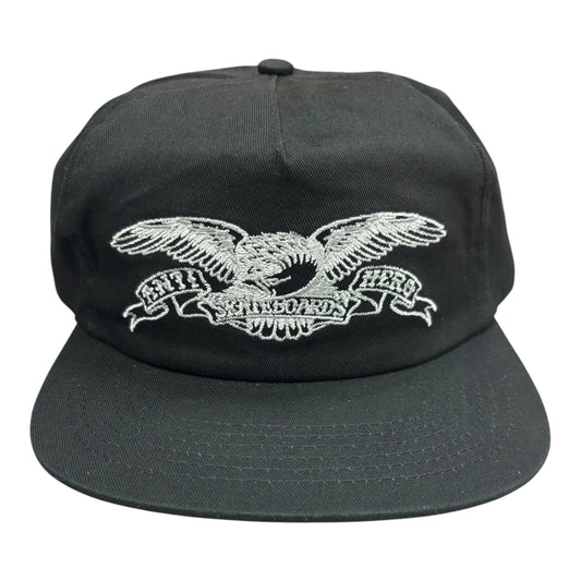 Black cap with white embroidered eagle design on a white background