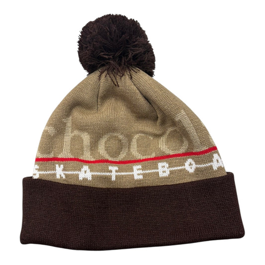 Knitted beanie with pom-pom on a white background