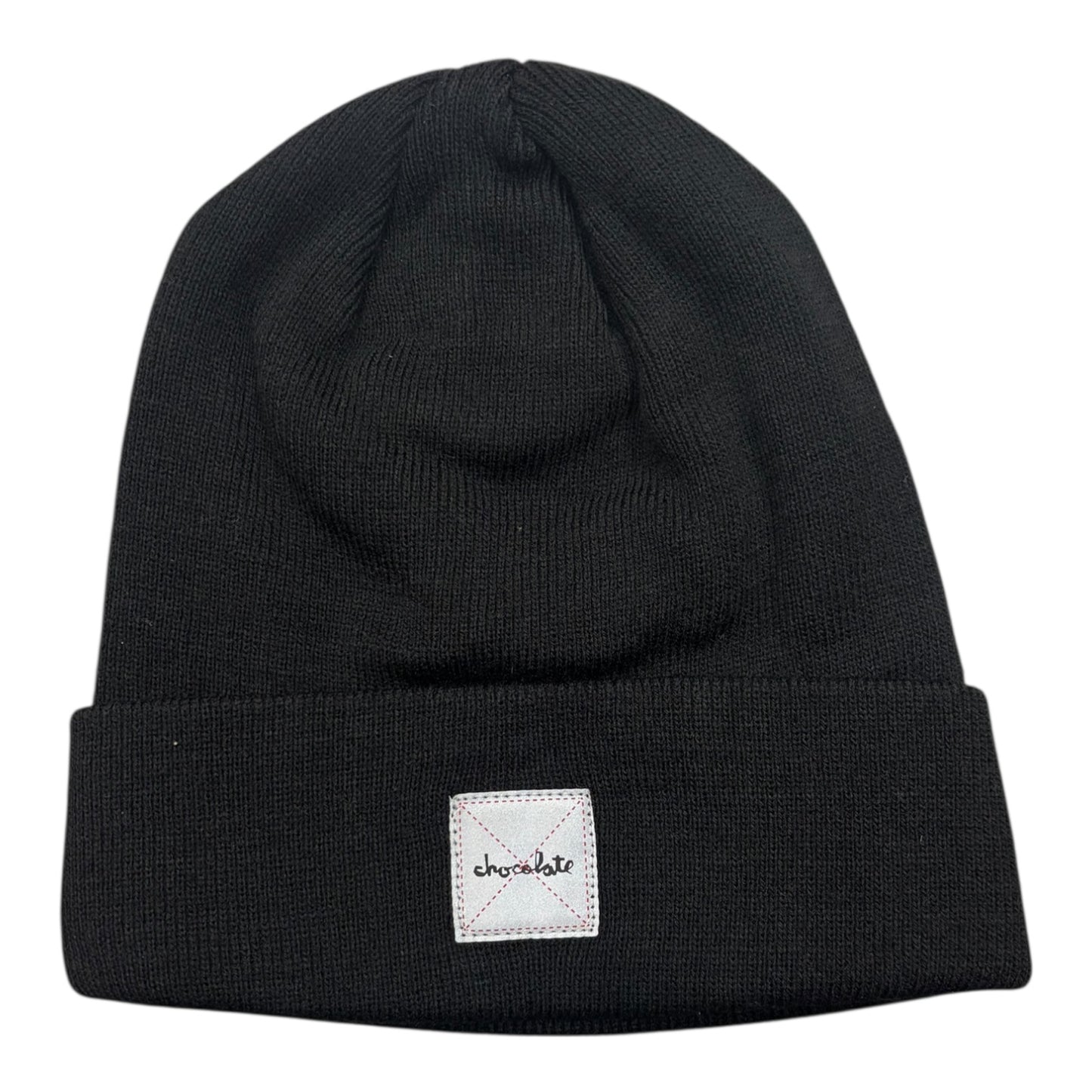 Black beanie with a white label on a white background