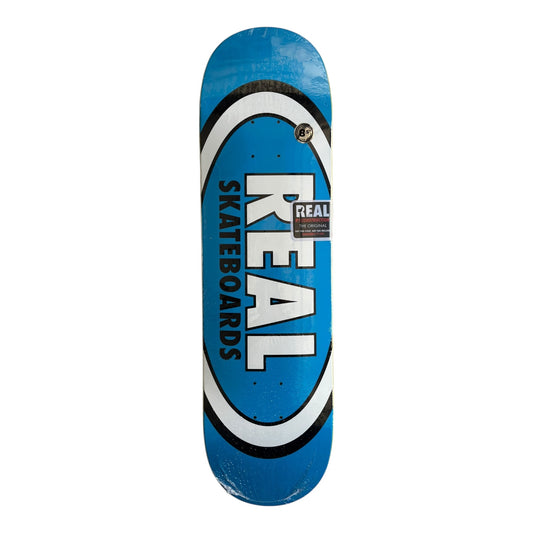 Blue skateboard deck with 'Real Skateboards' logo on a white background