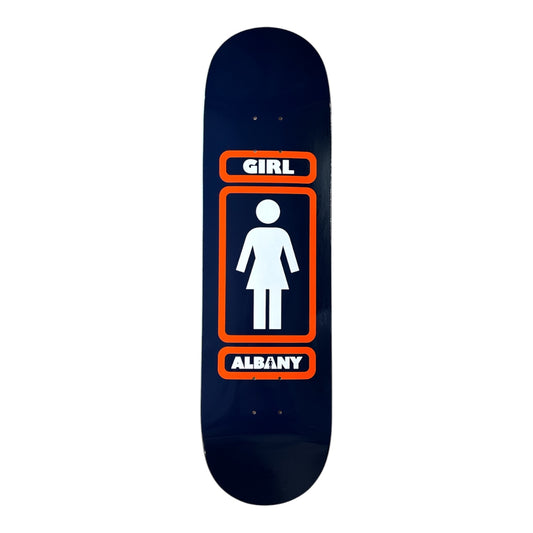 A skateboard deck featuring a dark navy blue background with a retro-style restroom sign graphic. The graphic includes an orange border, a white female figure icon, the word 'GIRL' at the top, and 'ALBANY' at the bottom.