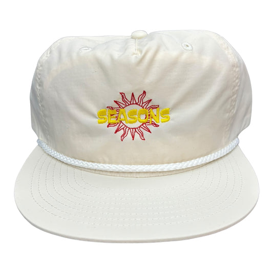 Cream Colored Nylon Hat with rope and seasons lSun logo embroidered in Red and Yellow