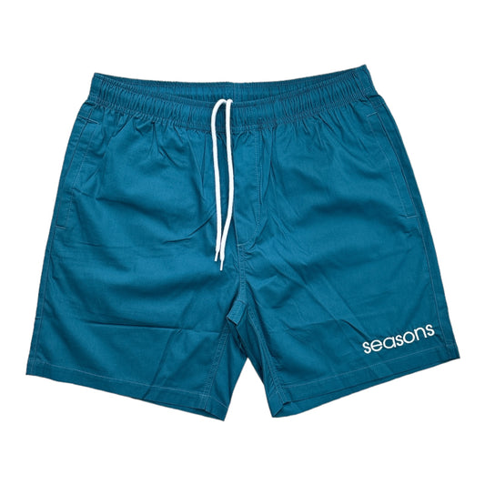 Atlantic blue shorts with seasons stamp font embroidered on left leg on white 