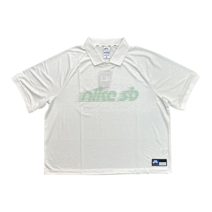 White polo shirt with green logo on a white background
