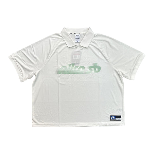 White polo shirt with green logo on a white background