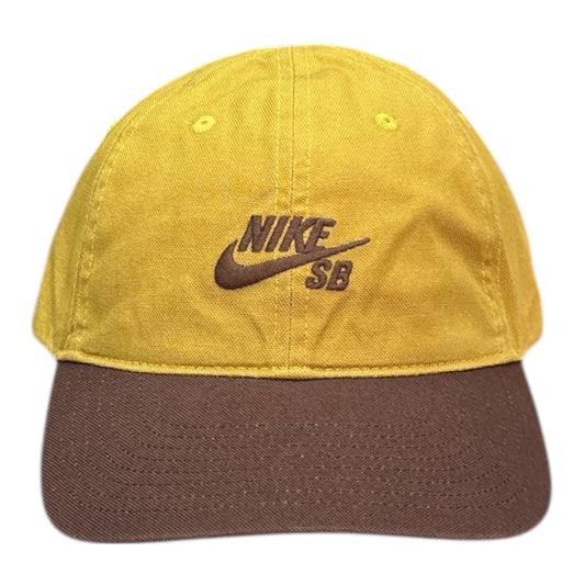 Yellow and brown cap with Nike SB logo on a white background