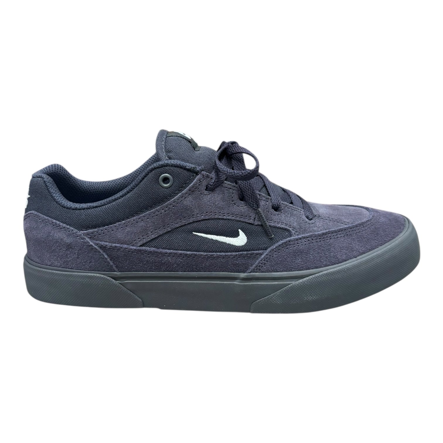 Navy blue sneaker with a white logo on a white background