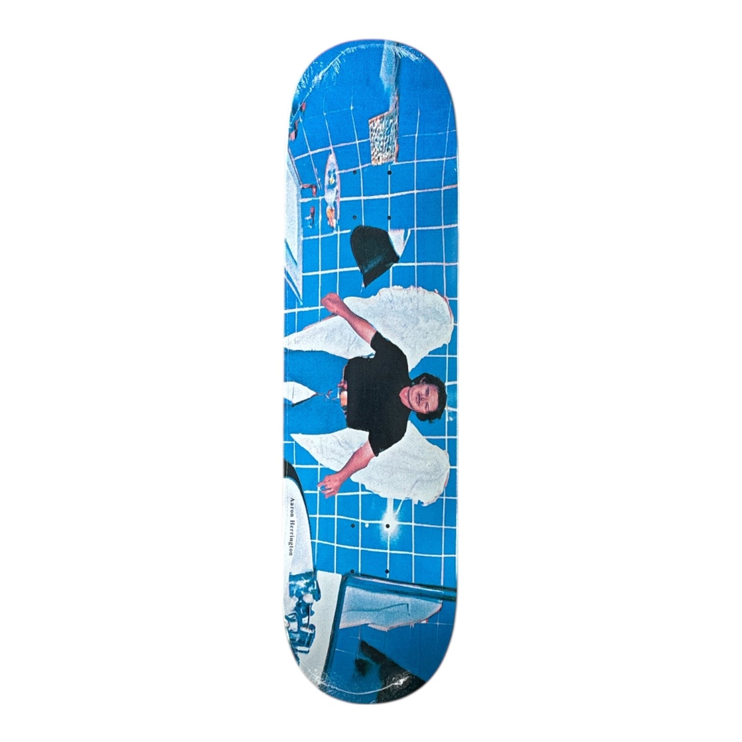 Skateboard deck with a graphic design of a person in a black shirt and white pants on a blue grid background.