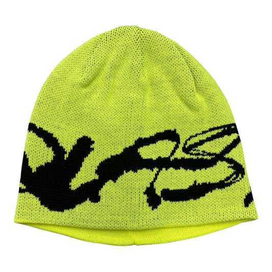 A neon yellow knit beanie hat featuring a large black stylized graphic across the front, displayed against a solid white background.