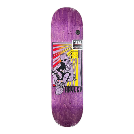 Purple skateboard deck with graphic design and 'Real' branding on a white background