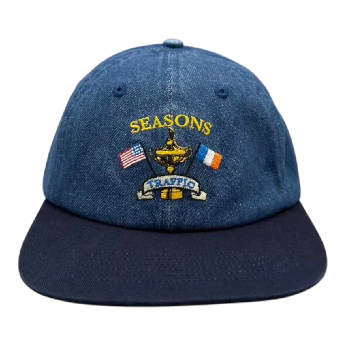 Blue denim cap with embroidered design on a white background
